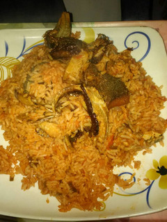A picture of Jollof rice with smoked fish.