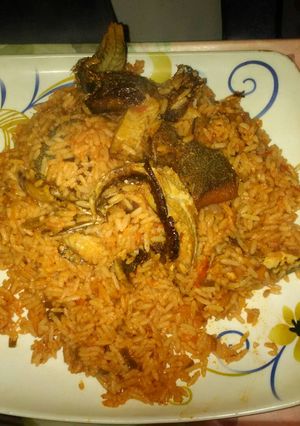 A picture of Jollof rice with smoked fish.