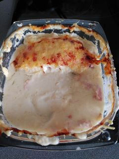Una foto de Rollitos de espárragos con jamón de York y queso en bechamel