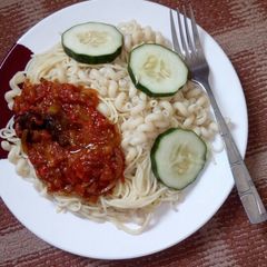 A picture of White spaghetti and macaroni with tomato sauce.