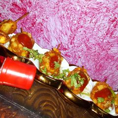 A picture of French fries corn potato paneer drum stick.