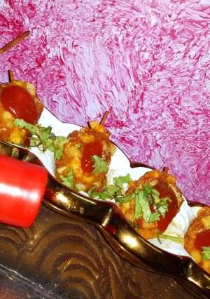 A picture of French fries corn potato paneer drum stick.