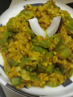 A picture of Jhinge narkol posto /ridge gourd in coconut and poppy seed paste.