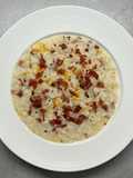 Risotto agli agrumi, caprino e speck