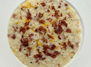 Foto di Risotto agli agrumi, caprino e speck