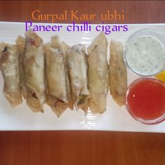 Cottage cheese chilli cigars (paneer chilli cigars)🧅🍅🌿 A picture of Cottage cheese chilli cigars (paneer chilli cigars)🧅🍅🌿.