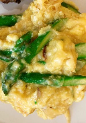 A picture of Scrambled eggs with Asparagus with Fontina, Gruyere and Gouda cheese.