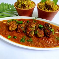 A picture of Smoked Chicken keema chop with gravy.