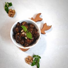 A picture of Zeytoon Parvardeh (Persian Marinated Walnuts & Pomegranate Olives).