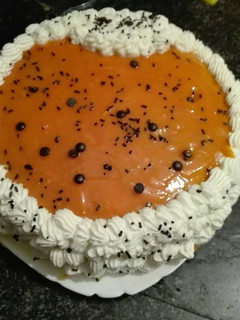 Una foto de Tarta de crema de naranja
