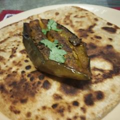 A picture of Stuff brinjal with Parantha.