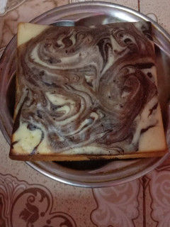 A picture of Marble cake 🎂 on stove.