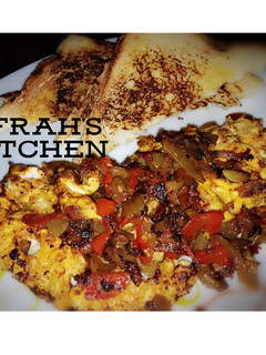 A picture of Fried Egg in homemade tomato sauce.