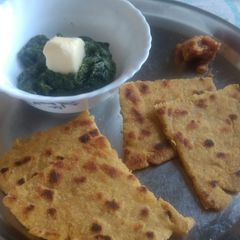 A picture of Sarson sag and makki roti.