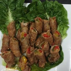 A picture of Sliced Pork Belly Wrapped Bell Peppers.