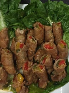 A picture of Sliced Pork Belly Wrapped Bell Peppers.