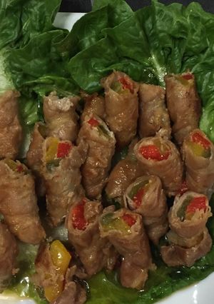 A picture of Sliced Pork Belly Wrapped Bell Peppers.