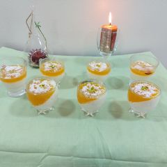 A picture of Orange milky creamy pudding.