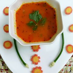 A picture of Carrots and tomato soup.