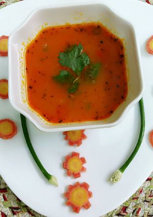 A picture of Carrots and tomato soup.
