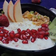 Yoghurt muesli with fresh fruit and nuts A picture of Yoghurt muesli with fresh fruit and nuts.