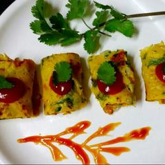 A picture of Coriander and vegetables chilla roll.