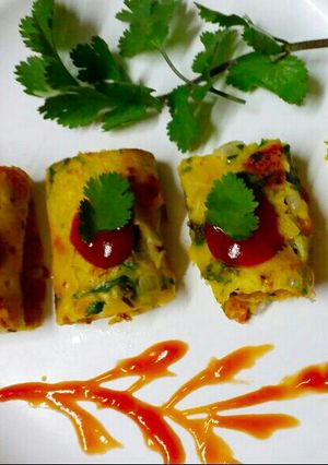 A picture of Coriander and vegetables chilla roll.