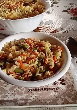 Une photo de Riz aux carottes et haricots verts 🥕🍚