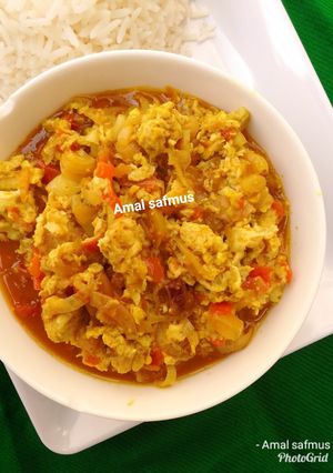 A picture of Simple egg sauce and white rice.