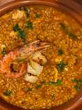 Arroz caldoso con rape, langostinos y vieiras