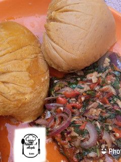 A picture of Moi moi with spinach sauce.