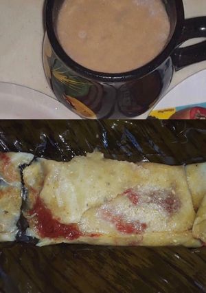 Una foto de Tamales de puerco en chileajo 🐖 🫔 y chocolate de cacao