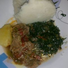 A picture of Stewed meat, skuma wiki and ugali.