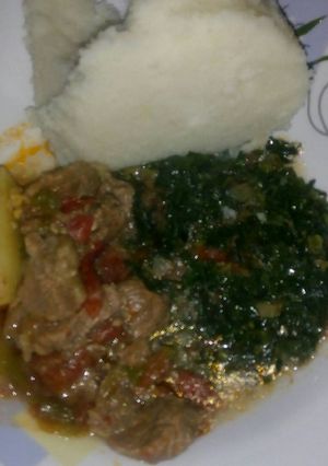 A picture of Stewed meat, skuma wiki and ugali.