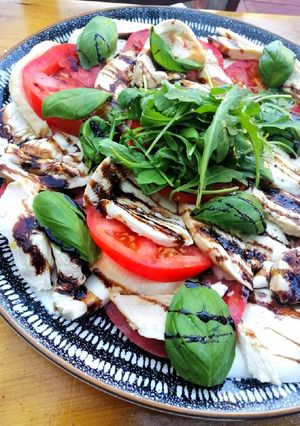 A picture of Smoked chicken caprese salad.