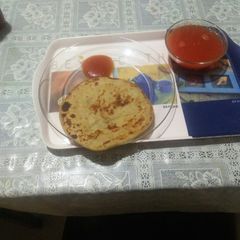 A picture of Stuff parantha and tomato soup.