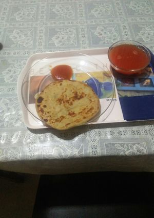 A picture of Stuff parantha and tomato soup.