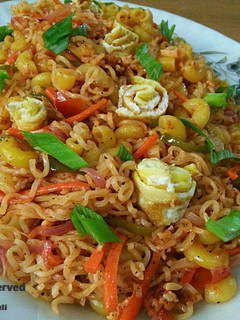 A picture of Maggi noddels with veggies and egg.