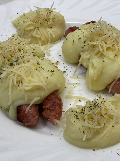 Una foto de Longaniza blanca con puré y queso al Wilson