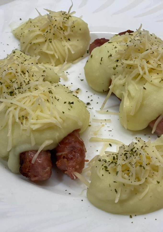 Una foto de Longaniza blanca con puré y queso al Wilson