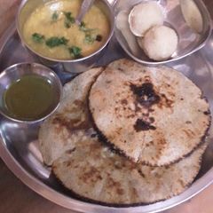 Urad dal with bajra roti A picture of Urad dal with bajra roti.
