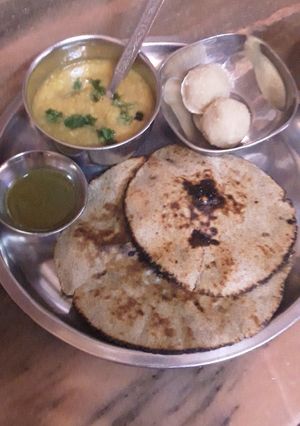 A picture of Urad dal with bajra roti.