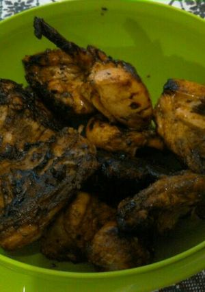 A picture of Grilled chicken on charcoal.