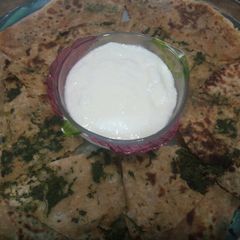 A picture of Aloo methi palak mix green paratha.