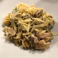 A picture of Pesto cream chicken with mushrooms and broad beans.