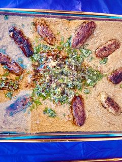 A picture of Lahori Hareesa with chicken kabab.