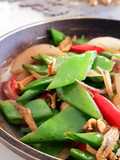 Snow Peas with Caramelized Onions and Crispy Anchovies