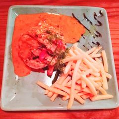 Chicken Grill steak with finger fried and red chilli sauce A picture of Chicken Grill steak with finger fried and red chilli sauce.
