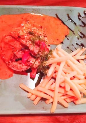 A picture of Chicken Grill steak with finger fried and red chilli sauce.