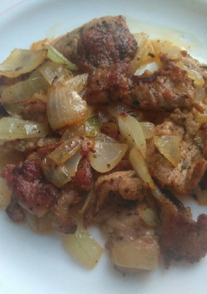 Una foto de Cerdo encebollado